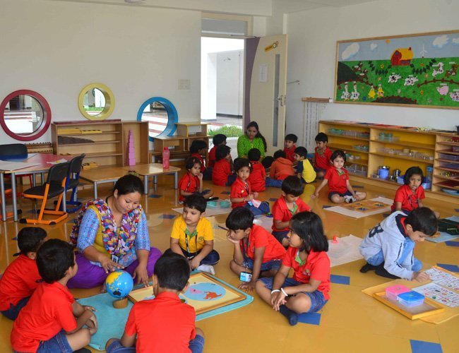 Young children learning together in a Montessori classroom at Harvest